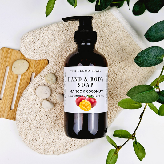 A 250ml glass bottle of liquid hand & body soap labeled 'Mango & Coconut', with a pump dispenser.